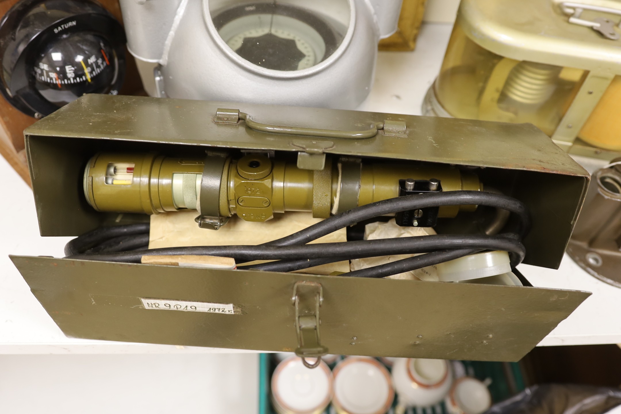 A World War Two gun-sight, ship's binnacle, barograph, etc.